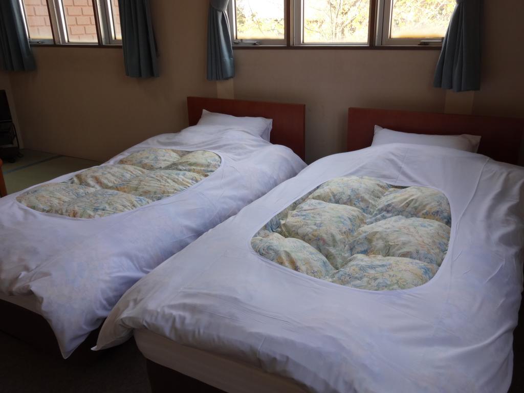 Oomukou Ryokan Hakuba Zimmer foto